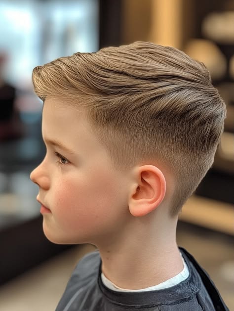 Young boy showing off a fresh tapered haircut.
