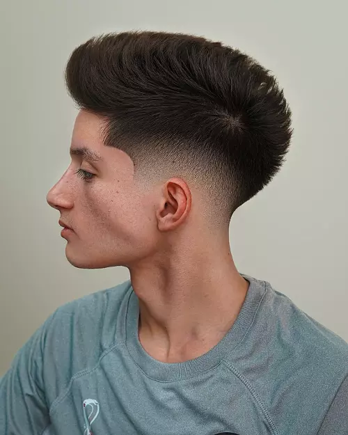 Side profile of a burst fade arcing around the ear.